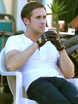 Ryan Gosling wearing leather driving gloves in the movie Drive